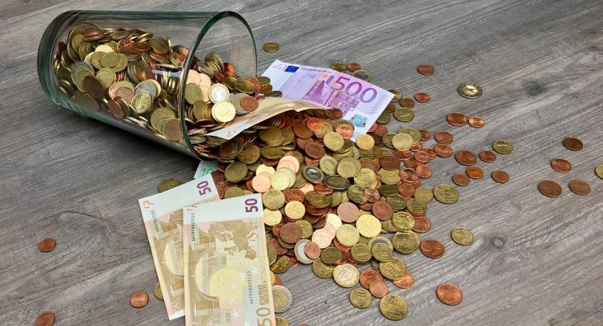 Glass with money 