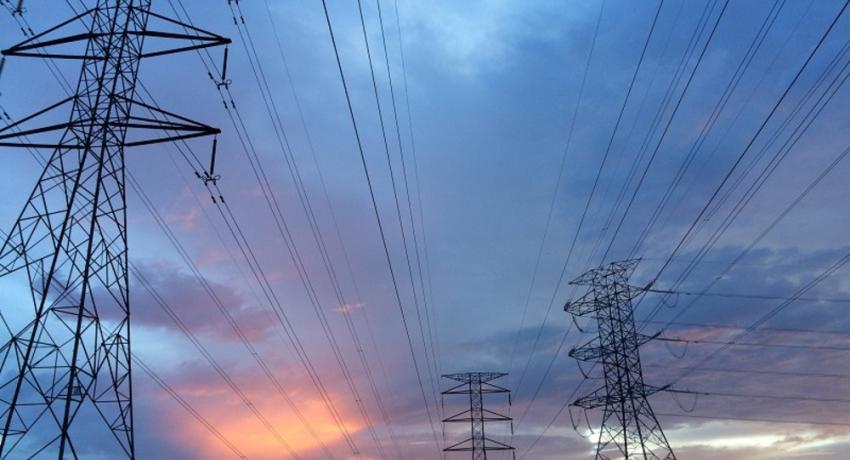 Electricity pylons at sunset