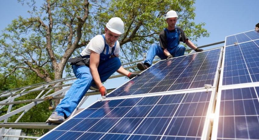 Men and solar panel