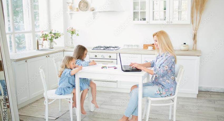 Woman working from home with children