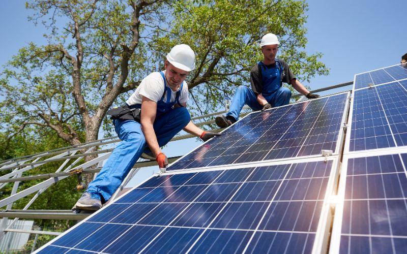 Men and solar panel